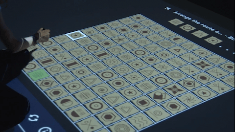 Coding Learning Floor — children programming with IR pens on interactive floor